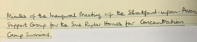 Close-up of the title page of the blue notebook. In a neat black cursive script is written ‘Minutes of the Stratford-upon-Avon Support Group for the Sue Ryder Homes for Concentration Camp Survivors 1963 – 1972’.