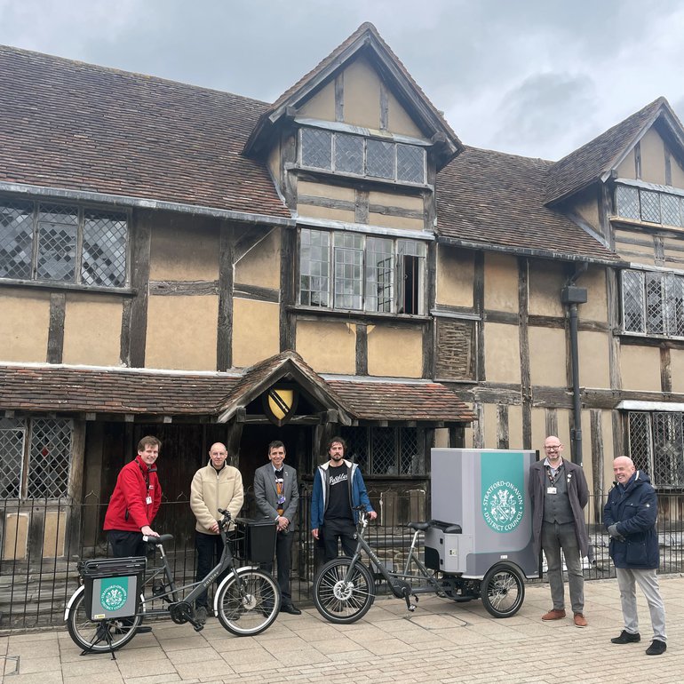 Representatives from the Shakespeare Birthplace Trust, Pashley's Cycles, Warwick District Council, and Stratford-on-Avon District Council with an e-cargo bike in front of Shakespeare's Birthplace.