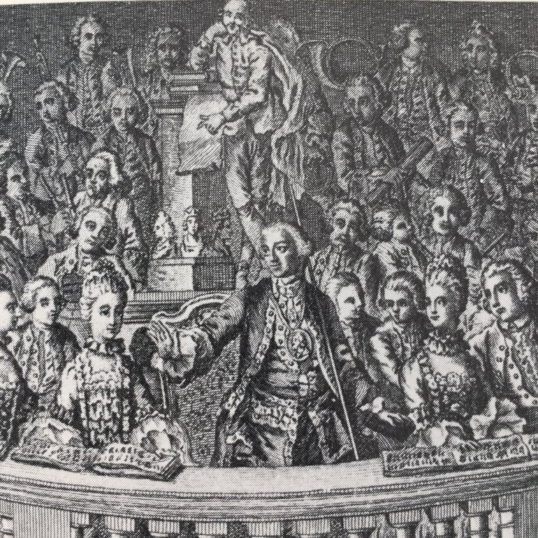 A black and white illustration of David Garrick with the statue of Shakespeare.