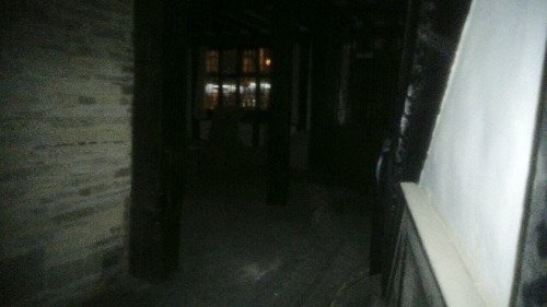 The photo shows the staircase, the wall, some distant reflections of the flash, and at the bottom a white smudge which in this reproduction isn't very clear.