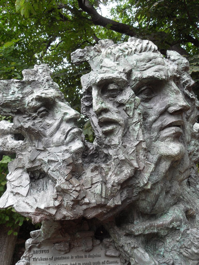 Greg Wyatt sculpture of Julius Caesar. Primarily a number of faces - Caesar, Brutus, Cassius and Mark Antony - and a number of daggers.