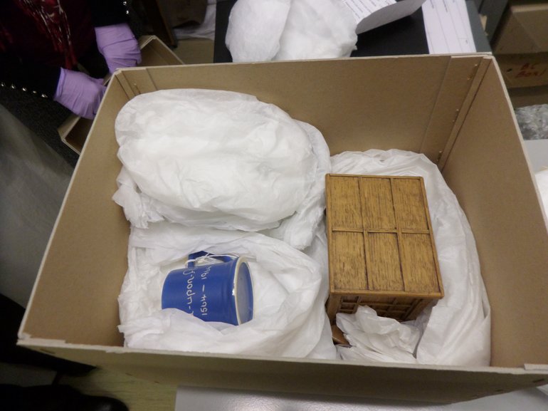 Storing museum items ‘nested’ in acid free tissue paper.