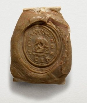 Memento Mori Seal, c.1600 (STRST: SBT 1872-4) The impression of a seal with a skull in the centre.