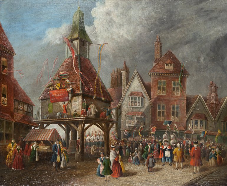 Market Cross Painting. The building above which is the short tower holding the Market Cross is raised on wooden pillars. The crowd to the right of it are surrounding two people on white horses, carrying banners, and all are facing the tall brick building to the right of the market cross.