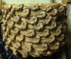 Detail from the bee skep, a shaped basket of woven straw.