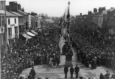 Crowds lining Bridge Street as the flags are unfurled to celebrate the anniversary of Shakespeare's birth.