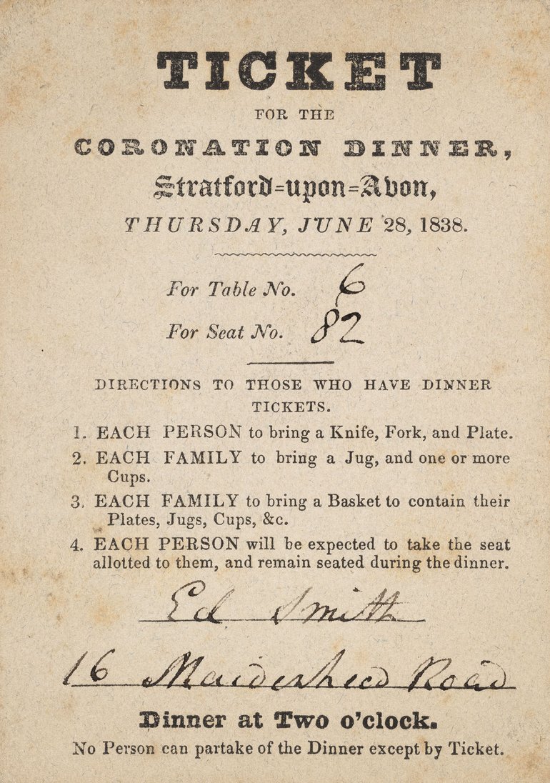 An invitation to a celebration of Queen Victoria's coronation in Stratford-upon-Avon. It is printed on yellowing parchment in a bold black font. The table number, seat number, and name and address of the invitee are handwritten in black ink.