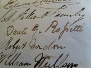 A close up on a page of autographs.